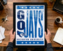 A framed poster with the text "G O JAYS" and the logo of Creighton University is being held by a person's hands.