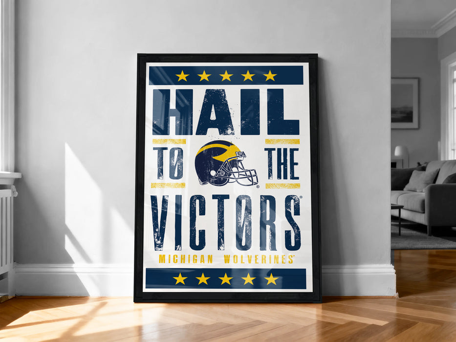 A framed poster with the text "Hail to the Victors" and a graphic of a football helmet, which appears to be a sports-themed poster.
