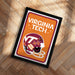 A framed poster with the text "VIRGINIA TECH" and an illustration of a football helmet, placed on a wooden floor.