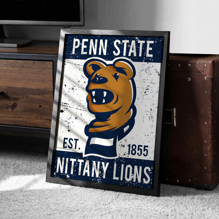 A framed poster featuring the Penn State Nittany Lions logo, with a vintage-style design.