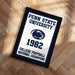 A framed poster with the text "Penn State University" and "College Football National Champions" on it, celebrating the 1992 College Football National Champions.
