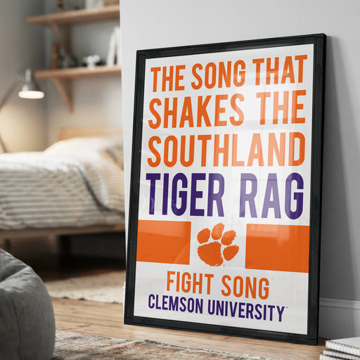 a framed poster with the text "THE SONG THAT SHAKES THE SOUTHLAND TIGER RAG" and "FIGHT SONG CLESTON UNIVERSITY" printed on it.