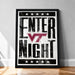 A framed poster with the text "ENTER NIGHT" and a graphic of a red "V" inside a black circle, surrounded by white stars.