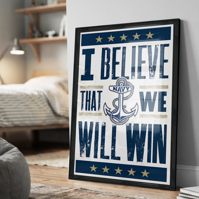 A framed poster with the text "I BELIEVE THAT WE WILL WIN" and an anchor symbol, placed on a wall in a room.
