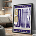 A framed poster with the text "GO DANES" and "UNIVERSITY OF WASHINGTON" printed on it, placed on a wall in a room.