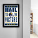 a framed poster with the text "Hail to the Victors" and a graphic of a football helmet, which appears to be a sports-themed poster.