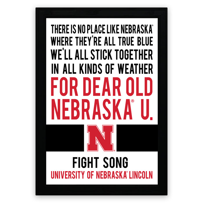 a framed quote that reads: "THERE IS NO PLACE LIKE NEBRASKA. WHERE THEY'RE ALL TRUE BLUE WE'LL ALL STICK TOGETHER IN ALL KINDS OF WEATHER FOR DEAR OLD NEBRASKA U. FIGHT SONG UNIVERSITY OF NEBRASKA LINCOLN"