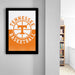 A framed poster of the Tennessee basketball team logo hangs on a wall, with a bookshelf visible in the background.
