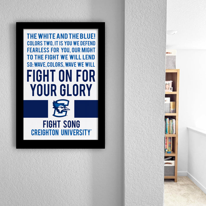 a framed poster with a motivational message about fighting on for one's glory, displayed on a wall in a room.