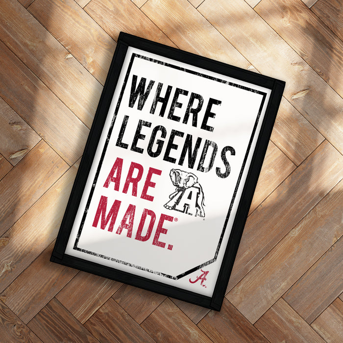A framed poster with the text "WHERE LEGENDS ARE MADE" and an illustration of an elephant.