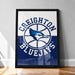 A framed poster of the Creighton Bluejays basketball team, featuring the team's logo and name.