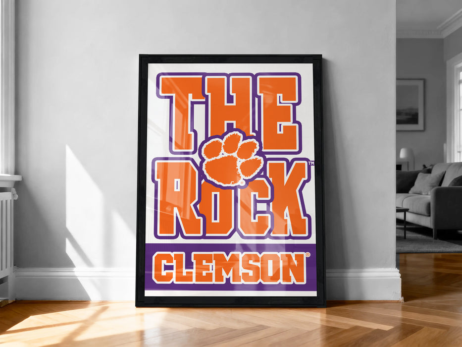 A framed poster with the text "THE ROCK CLIMBERS" and a paw print logo, representing the University of South Carolina's football team.