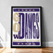 A framed poster with the text "GO DAVGS" and the University of Washington logo, placed on a wooden floor against a white wall.