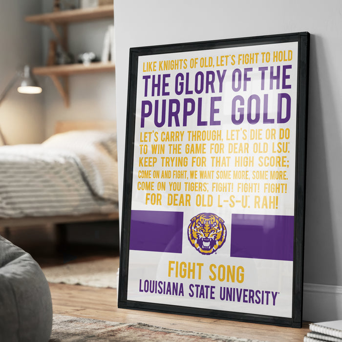 a framed poster with text and a tiger logo, placed on a wooden floor in a room.