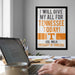 a framed poster with the text "I WILL GIVE MY ALL FOR TENNESSEE TODAY!" and "VOL WALK UNIVERSITY OF TENNESSEE" on a wall, with a person's hands typing on a laptop in the foreground.