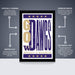 The image is a poster for the University of Washington's football team, specifically the Washington Ducks. The poster features the team's logo and name in a bold, purple and gold color scheme. The poster is described as " Officially Licensed" and "Premium Printed", indicating that it is a high-quality, professionally printed poster. The poster is also described as "Shipped Flat" and "The Perfect Gift", suggesting that it is a convenient and thoughtful gift option.