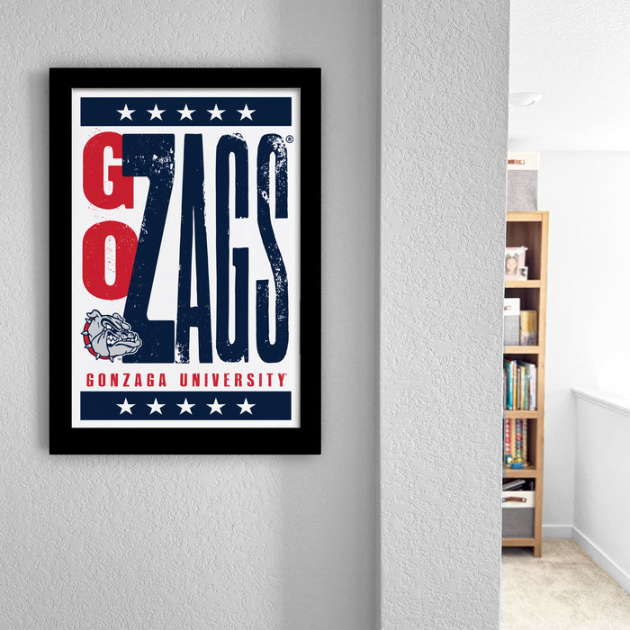 a framed poster with the text "GO ZAGS" and "GONZAGA UNIVERSITY" printed on it, hanging on a wall.