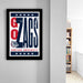 a framed poster with the text "GO ZAGS" and "GONZAGA UNIVERSITY" printed on it, hanging on a wall.
