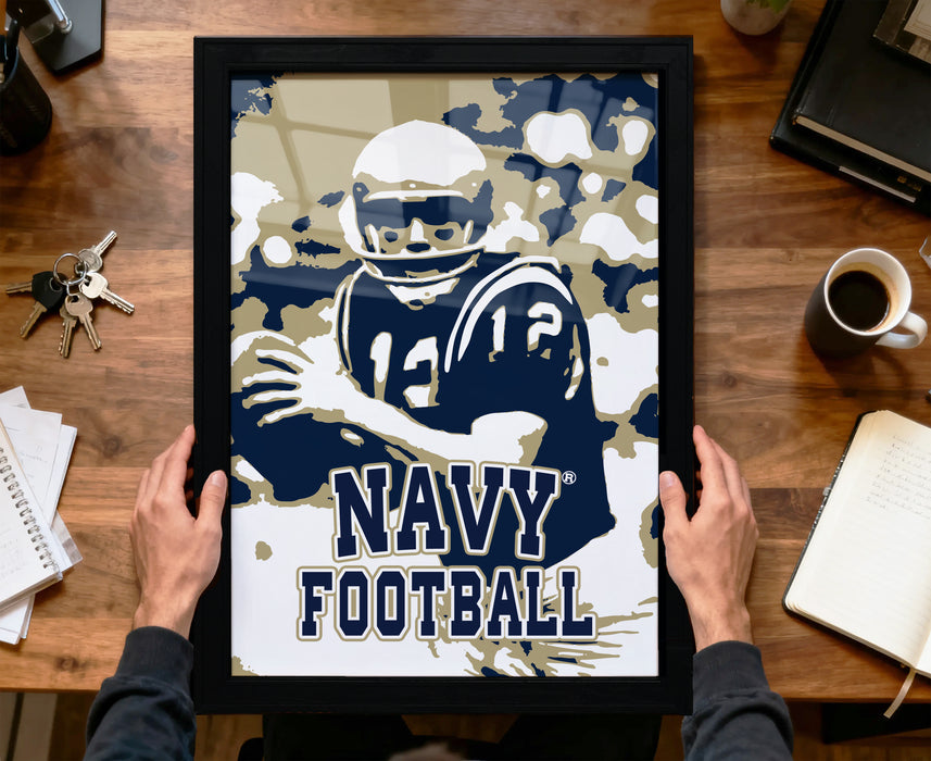 A framed poster of a football player in a navy uniform, with the text "NAVY FOOTBALL" prominently displayed.