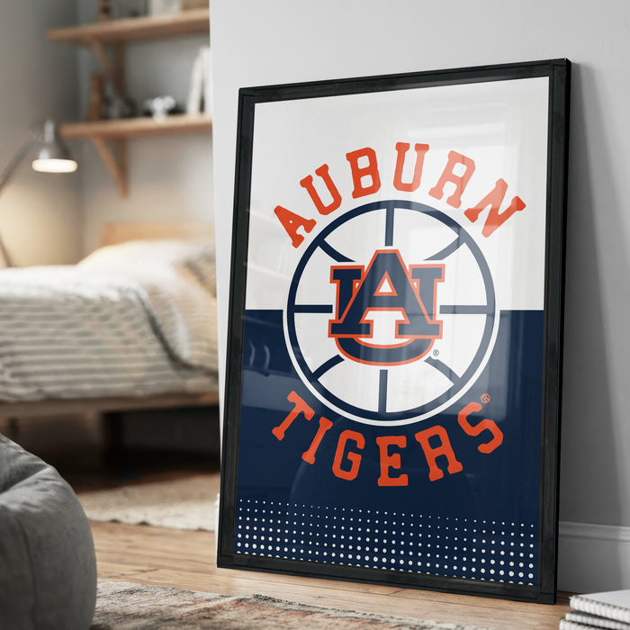 A framed poster with the text "AUBURN TIGERS" and a basketball logo, displayed on a wall in a bedroom.