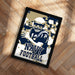 A framed poster featuring a football player in a navy uniform, with the text "NAVY FOOTBALL" prominently displayed.