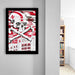 a framed poster with a skull and crossbones design, along with text that reads "HUSKERS IN THE GLORY".