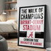 The image is a framed poster advertising "The Walk of Champions" at the Bryant-Denny Stadium, featuring the University of Alabama logo.