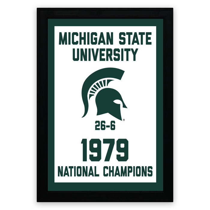 A framed poster celebrating the Michigan State University's 1979 National Champions, featuring the university's logo and the text "Michigan State University 1979 NATIONAL CHAMPIONS"