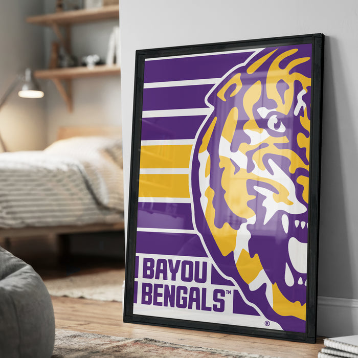A framed poster of the LSU (Louisiana State University) football team, specifically the "Bengals", is displayed on a wall in a bedroom.