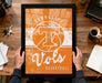 A person is holding up a framed poster with the text "TENNESSEE Vols" and "BASKETBALL" on it, which appears to be a sports-themed artwork.