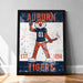 a framed poster of an animated tiger character wearing a football jersey with the text "AUBURN EST. 1856 TIGERS" printed on it.