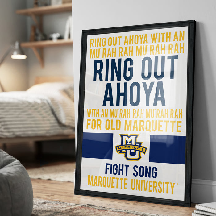 a framed poster with text and a logo, placed on a wall in a bedroom.