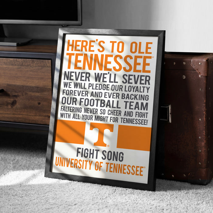 a framed poster with text that reads "HERE'S TO OLE TENNESSEE" and "FIGHT SONG UNIVERSITY OF TENNESSEE".