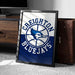 A framed poster of the Creighton Bluejays basketball team, featuring the team's logo and name, is displayed on a carpeted floor next to a wooden chest.