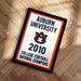 The image is a framed poster with the text "Auburn University 2010 College Football National Champions" displayed prominently.