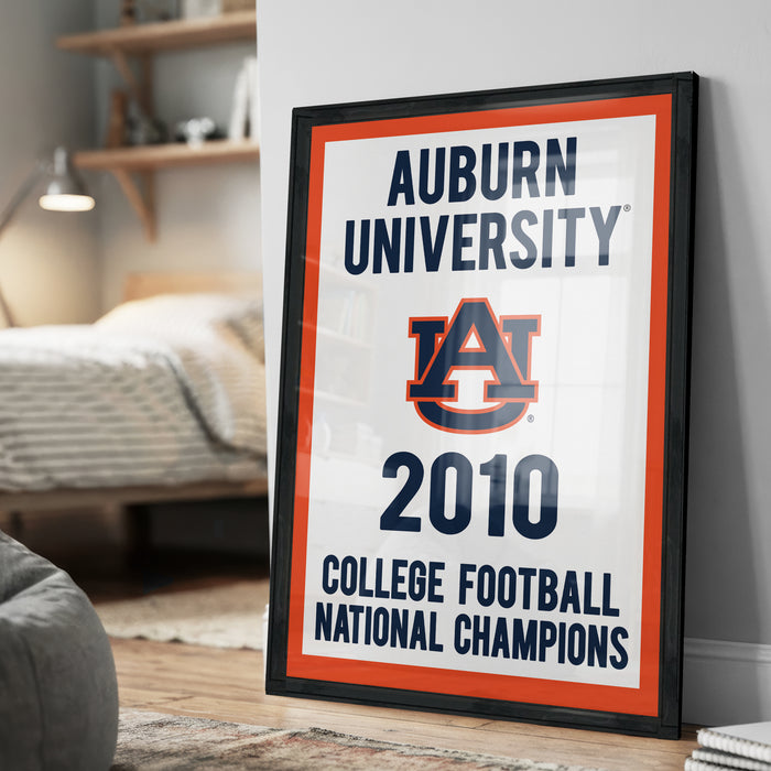 a framed poster celebrating Auburn University's 2010 College Football National Champions.