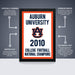 a college football poster hanging on a wall