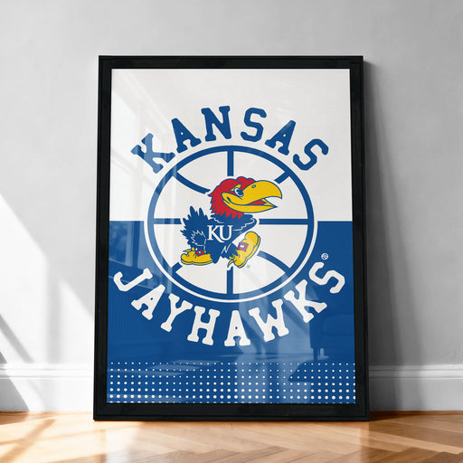 A framed poster featuring the Kansas Jayhawks logo, a bird with a yellow beak and red head, against a blue background with a white dotted pattern.