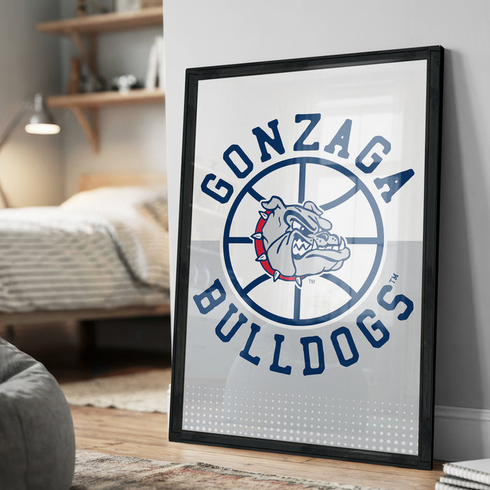 A framed poster of the Gonzaga Bulldogs basketball team logo is displayed on a wall in a bedroom.