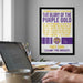 a framed poster with text and a tiger logo, hanging on a wall above a desk with a laptop and other items.