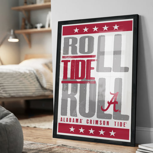 A framed poster with the text "ROLL TIDE A" in red and white, along with the text "ALABAMA'S CRIMSON TIDE" in black, is displayed on a wall.