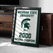 A framed poster celebrating the Michigan State University (MSU) National Champions, with the text "Michigan State University" and "2000 National Champions" prominently displayed.