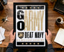 A person is holding up a framed poster with the text "GARMY BEAT NAVY" and the logo of the U.S. Military Academy.