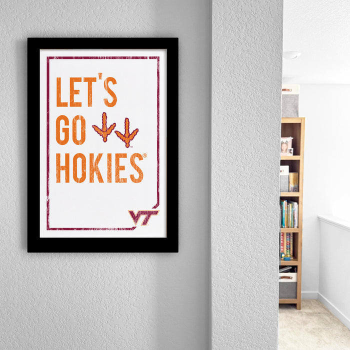 a framed poster with the text "LET'S GO HOKIES" and a Virginia Tech logo, hanging on a wall.