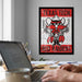 a poster of a Texas Tech football team mascot, with the text "Texas Tech" and "Red Raiders" displayed prominently. In the foreground, there is a laptop computer and a coffee mug on a desk, suggesting a workspace or study area.