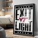 A framed poster with the text "EXIT LIGHT" and a Virginia Tech (VT) logo, displayed on a wall in a bedroom.