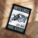 A framed poster with the text "UNITED STATES NAVAL ACADEMY EST. 1845" and an illustration of a bull wearing a naval hat.
