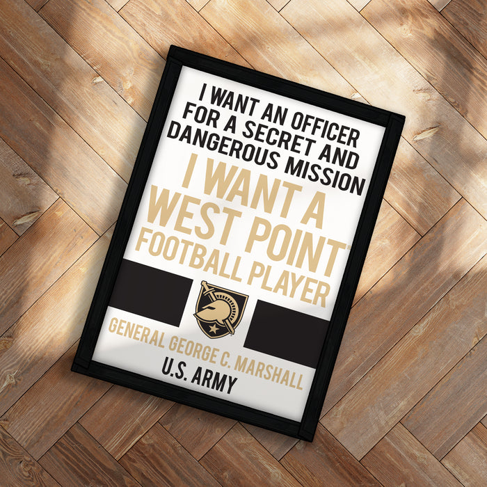 The image is a framed poster with text and a logo, placed on a wooden surface.