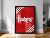 A large red poster with the word "Huskies" written on it, displayed on a wall in a room with a wooden floor.
