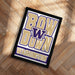 A framed poster with the text "BOW W down WASHINGTON" on it, placed on a wooden floor.